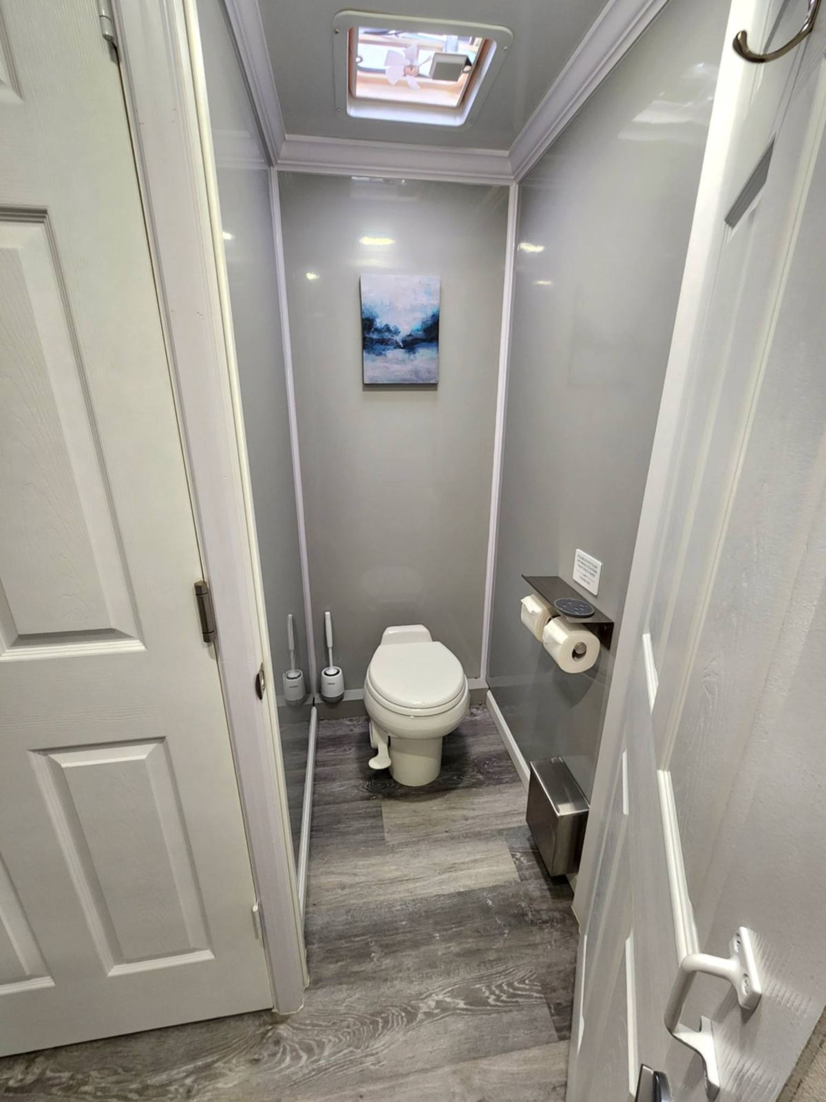 Restroom stall with beach artwork