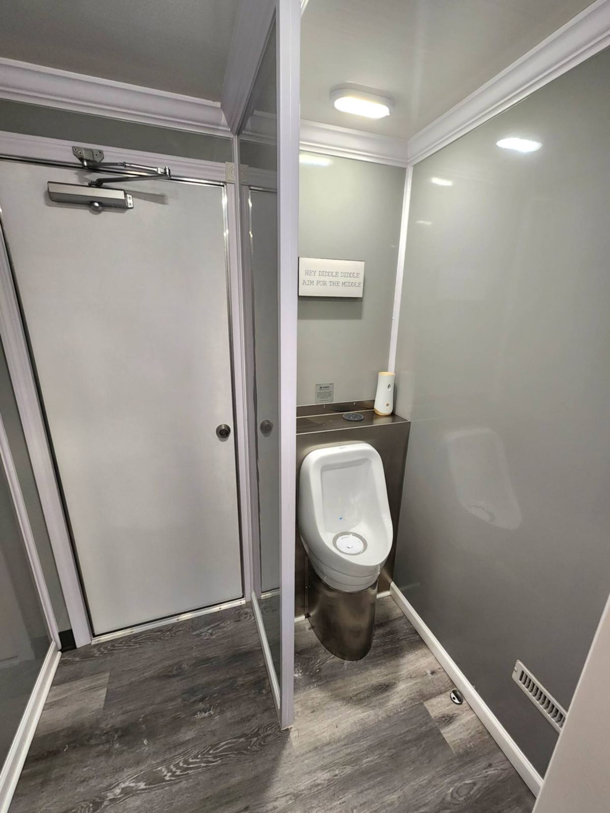 Vanity with mirror and dispensers